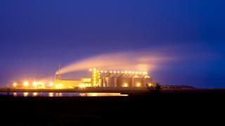 Night photograph of a ethanol plant with lights glowing