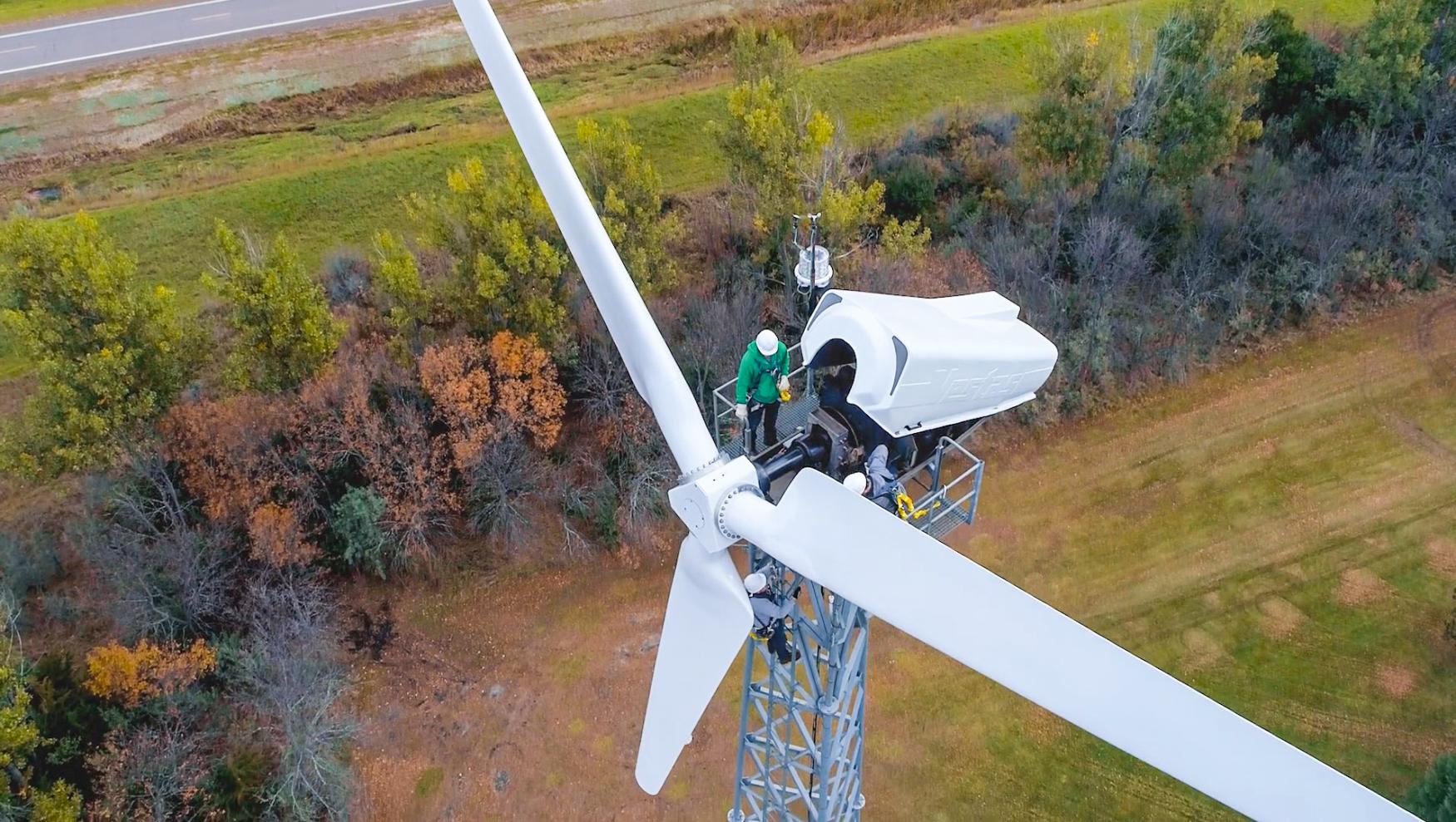 A technician working on a wind turbine