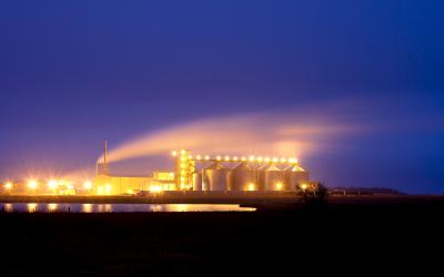 Night photograph of a ethanol plant with lights glowing